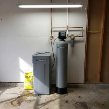 Whole-house water softener system installed in a home