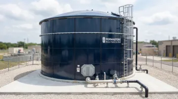 Large glass-lined steel water storage tank at municipal water infrastructure facility