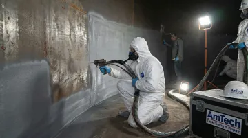 AmTech Tank technicians performing abrasive blasting and lining application on industrial storage tank