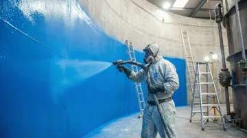 Polyurea spray coating application inside large industrial water storage tank