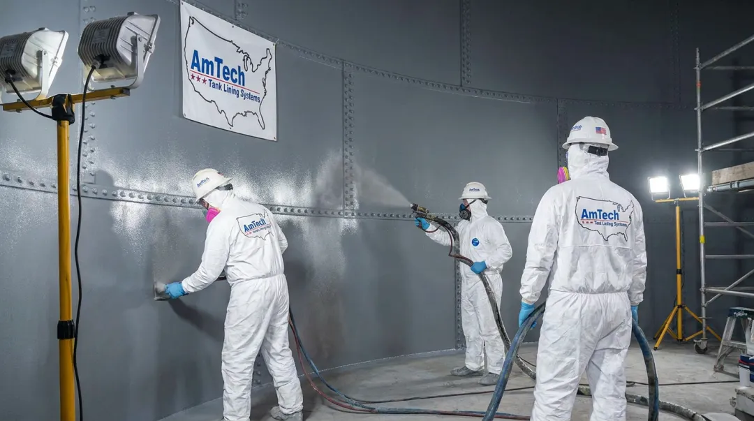 AmTech field crew applying lining system inside bolted steel storage tank