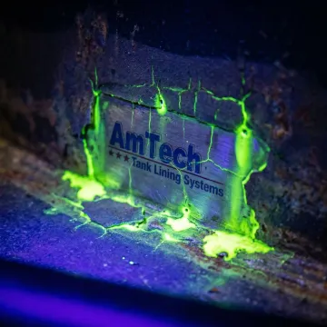 UV light inspection revealing coating defects during ASTM F1929 testing