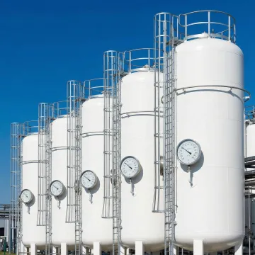 Commercial propane storage tanks with safety equipment and maintenance access