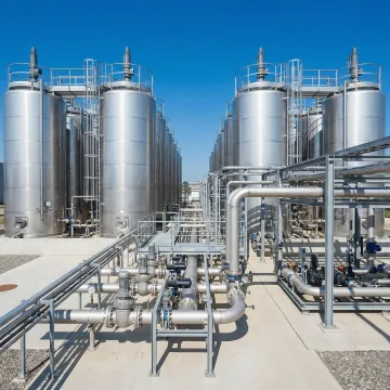 Industrial storage tank facility with multiple large steel tanks