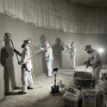Concrete fire suppression tank relining crew