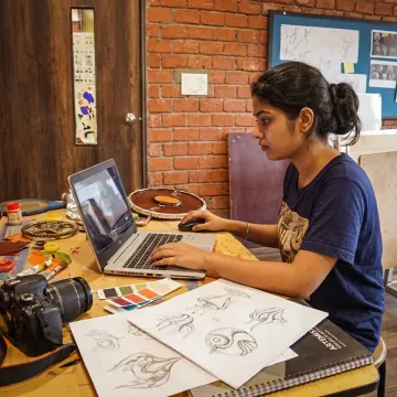 Student creating a digital creative portfolio