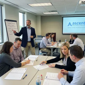 Leadership trainer coaching business team