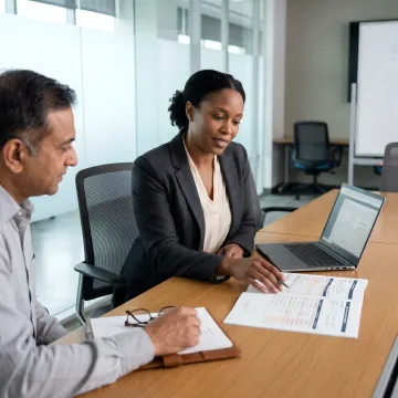 Leadership coach reviewing an executive action plan