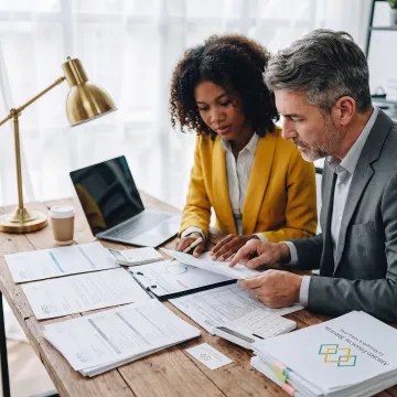 Tax professional reviewing IRS documents with a business client
