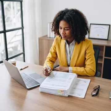 Tax professional reviewing organized tax documents