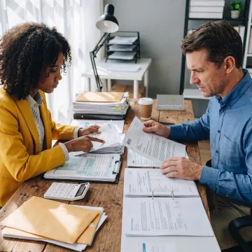 Tax professional reviewing IRS documents with a client
