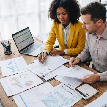 Tax consultant reviewing IRS documents with a client