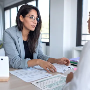 IRS Enrolled Agent meeting with a tax client