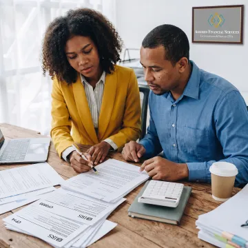 Tax professional reviewing IRS tax debt documents