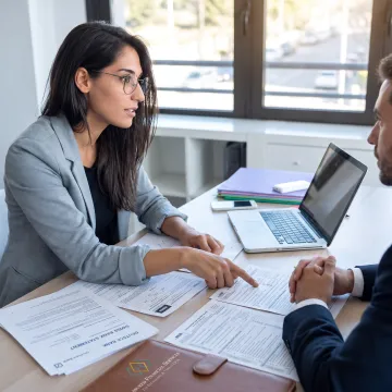 Advisor discussing international tax compliance with business client