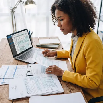 Tax professional reviewing international tax documents