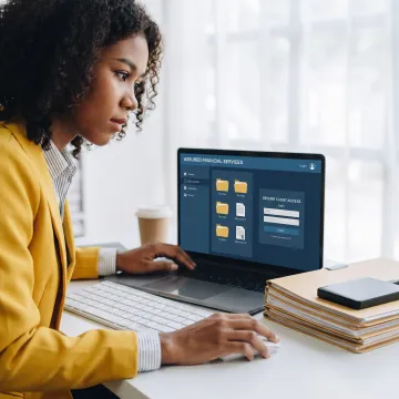 Tax professional reviewing digital tax documents