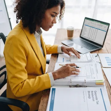 Tax professional organizing a business IRS resolution file