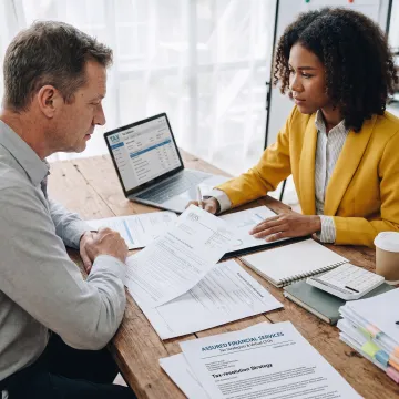 Tax advisor discussing an IRS resolution strategy
