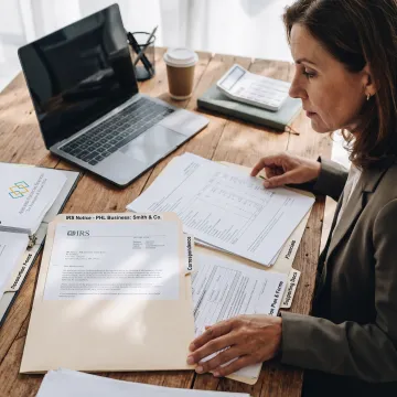 Tax advisor organizing IRS resolution paperwork