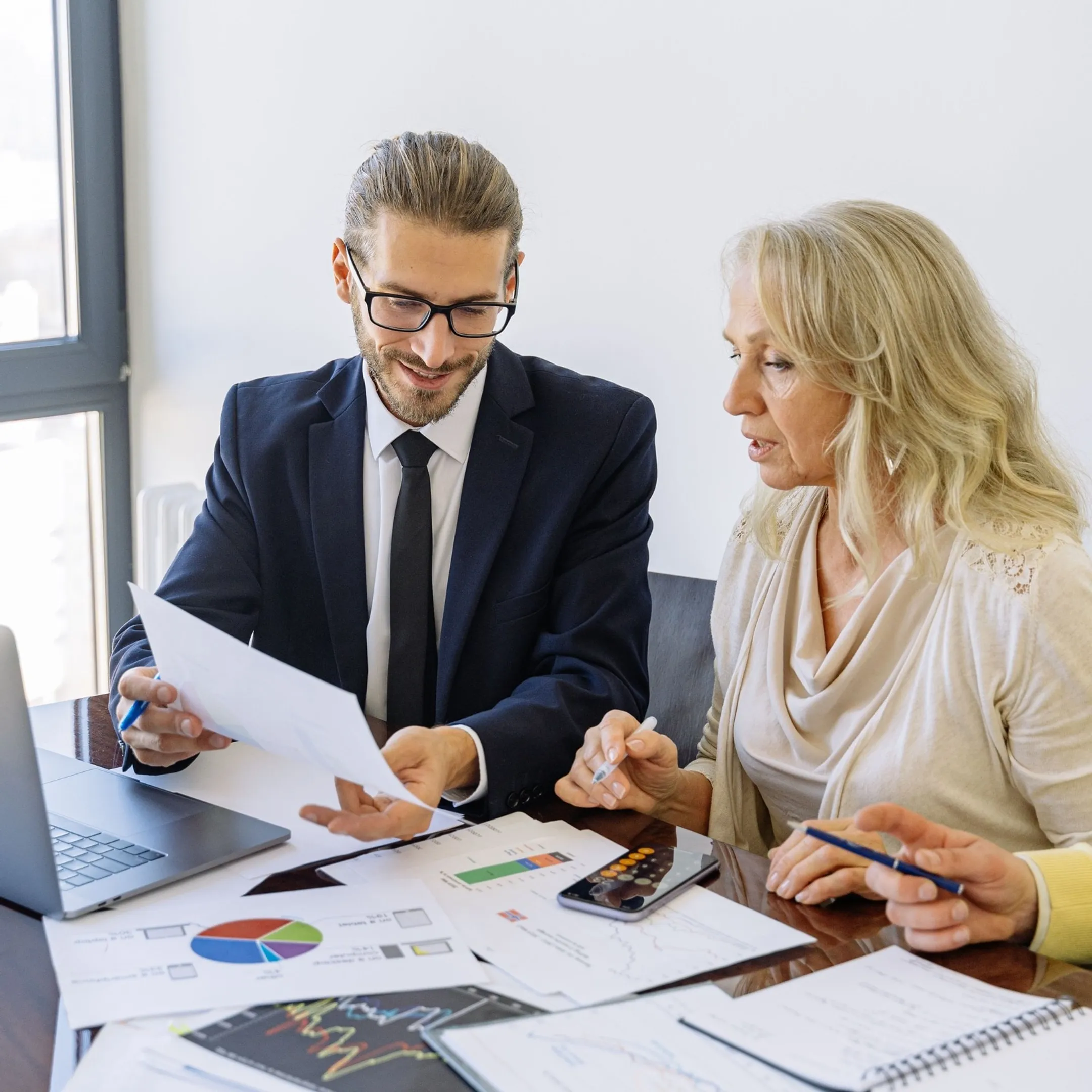 Business leaders reviewing a financial forecast