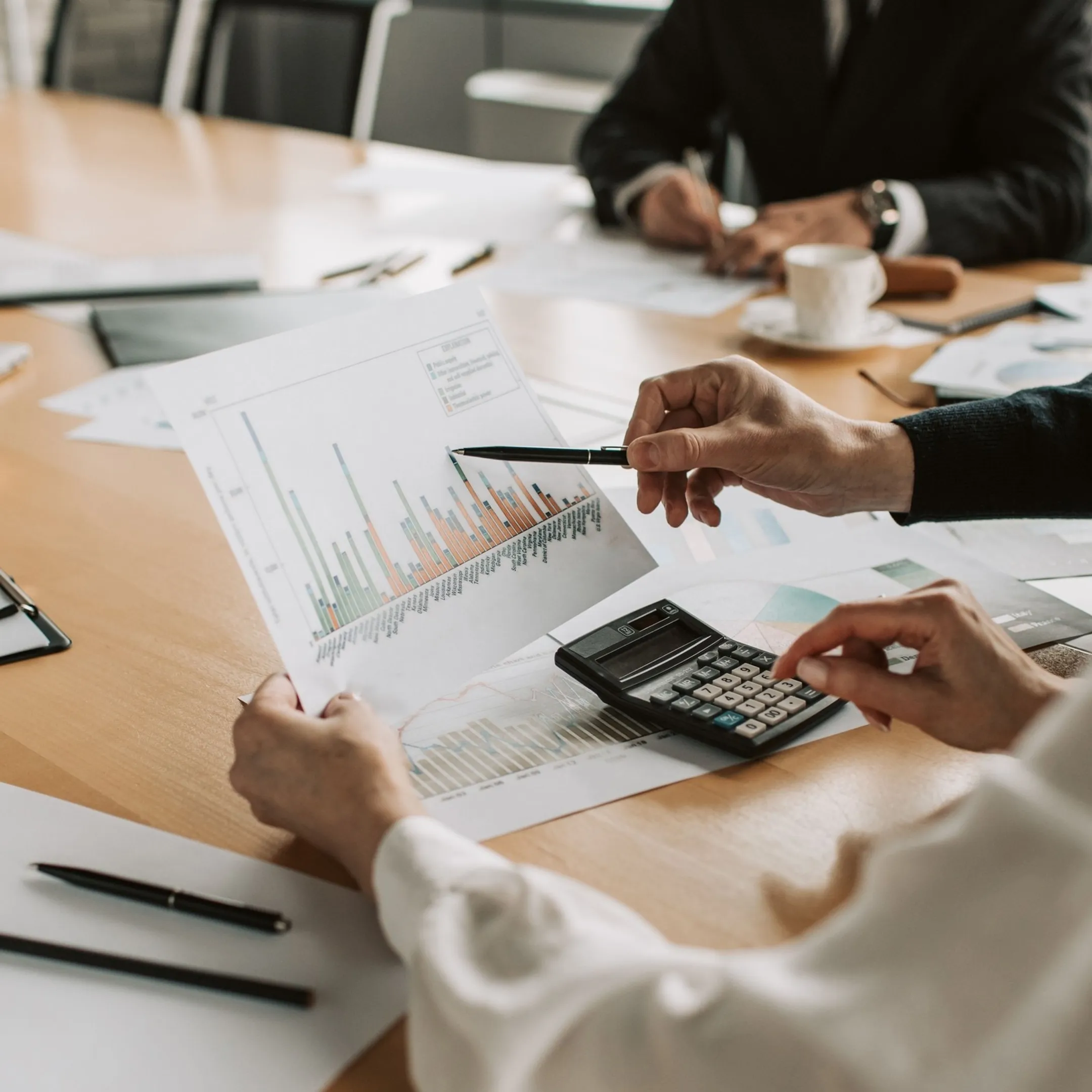 Financial advisor reviewing business performance reports