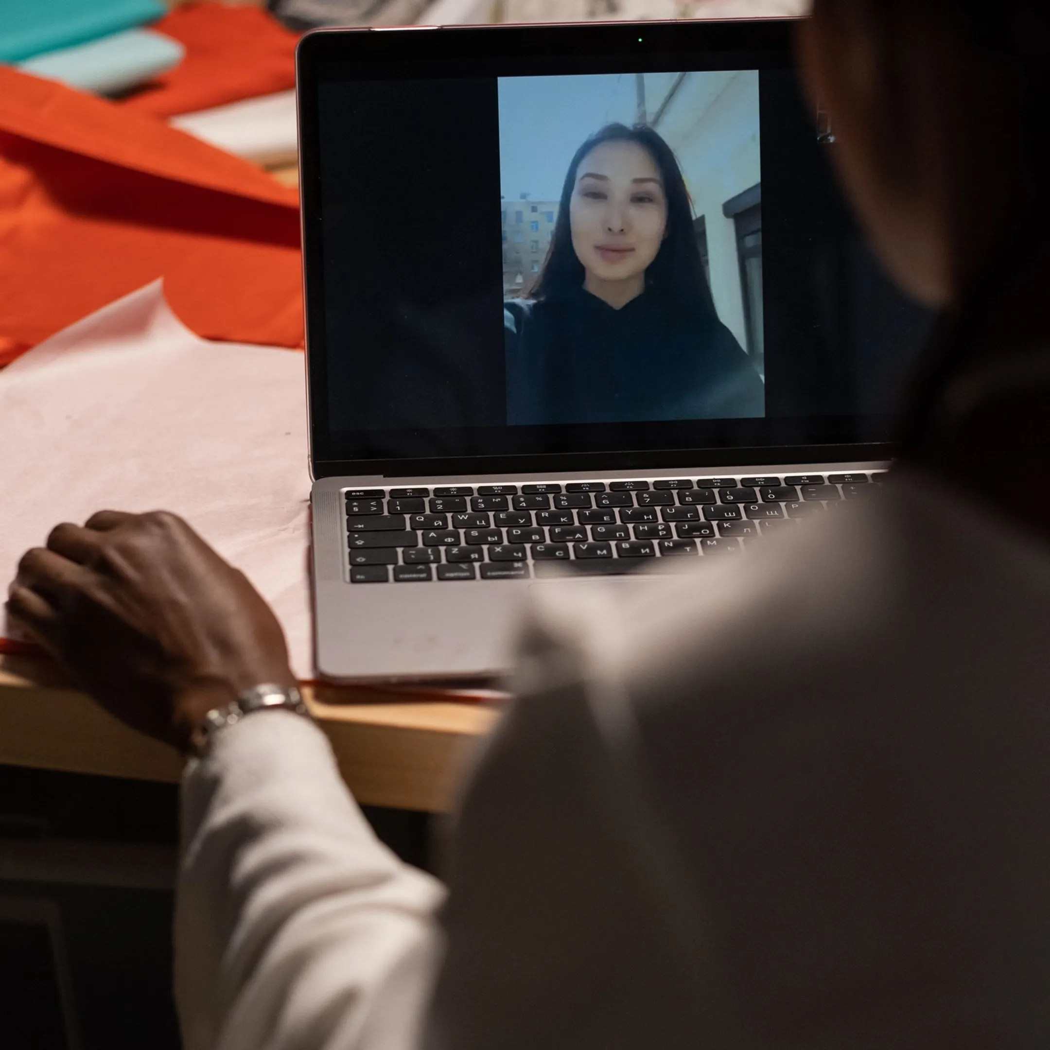 Tax professional reviewing tax documents on a laptop