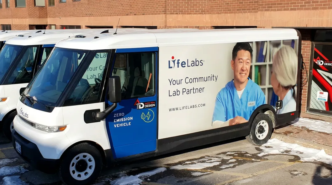 Branded fleet vehicle wrap showing consistent logo and colour matching