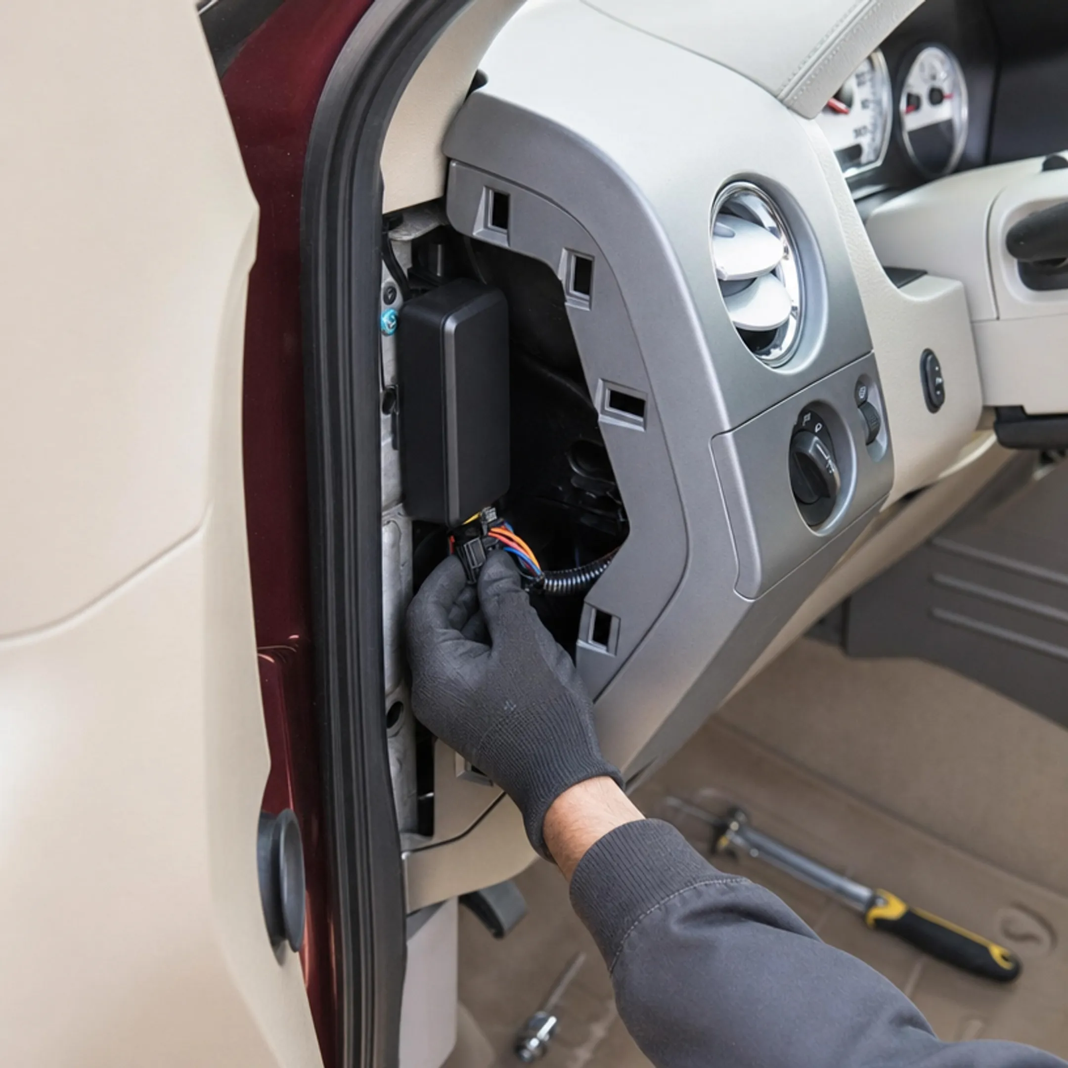 Fleet service vehicle equipped with GPS tracking device on dashboard
