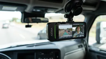 Azuga SafetyCam AI dual-facing dashcam capturing road and driver footage