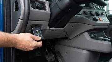 ELD hardware device connected to truck OBD-II diagnostic port