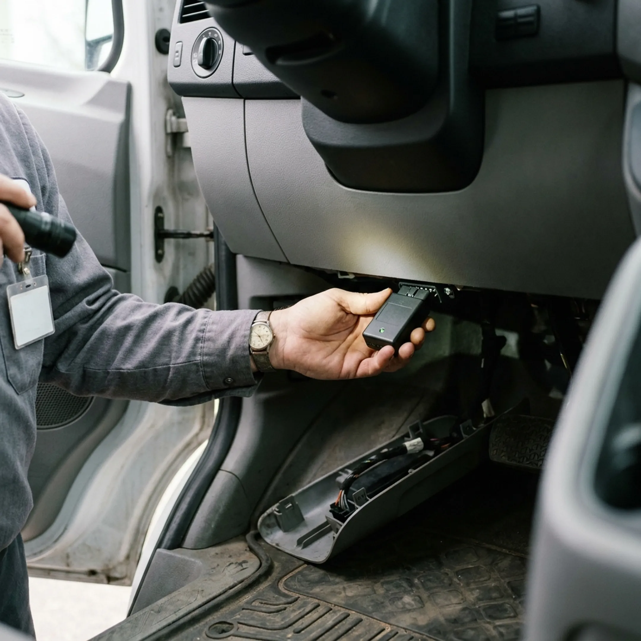 OBD-II telematics device connected to vehicle diagnostics port