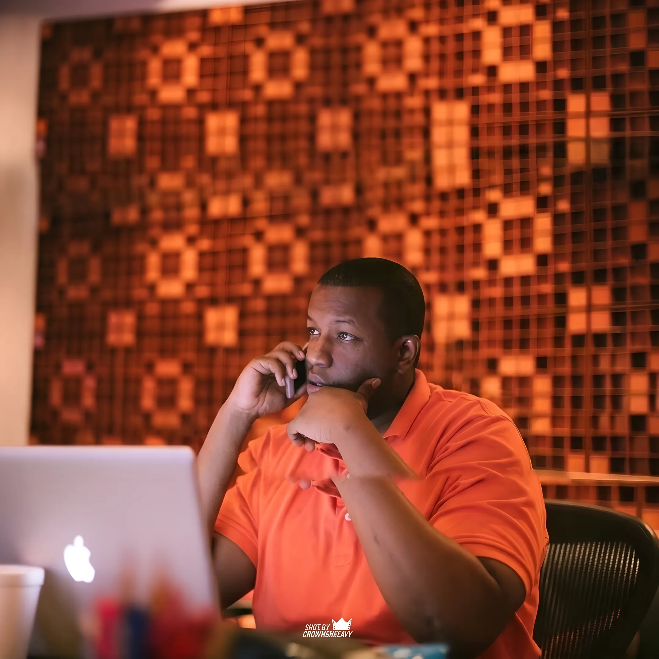 Entertainment industry executive reviewing rollout schedules and media plans on a monitor