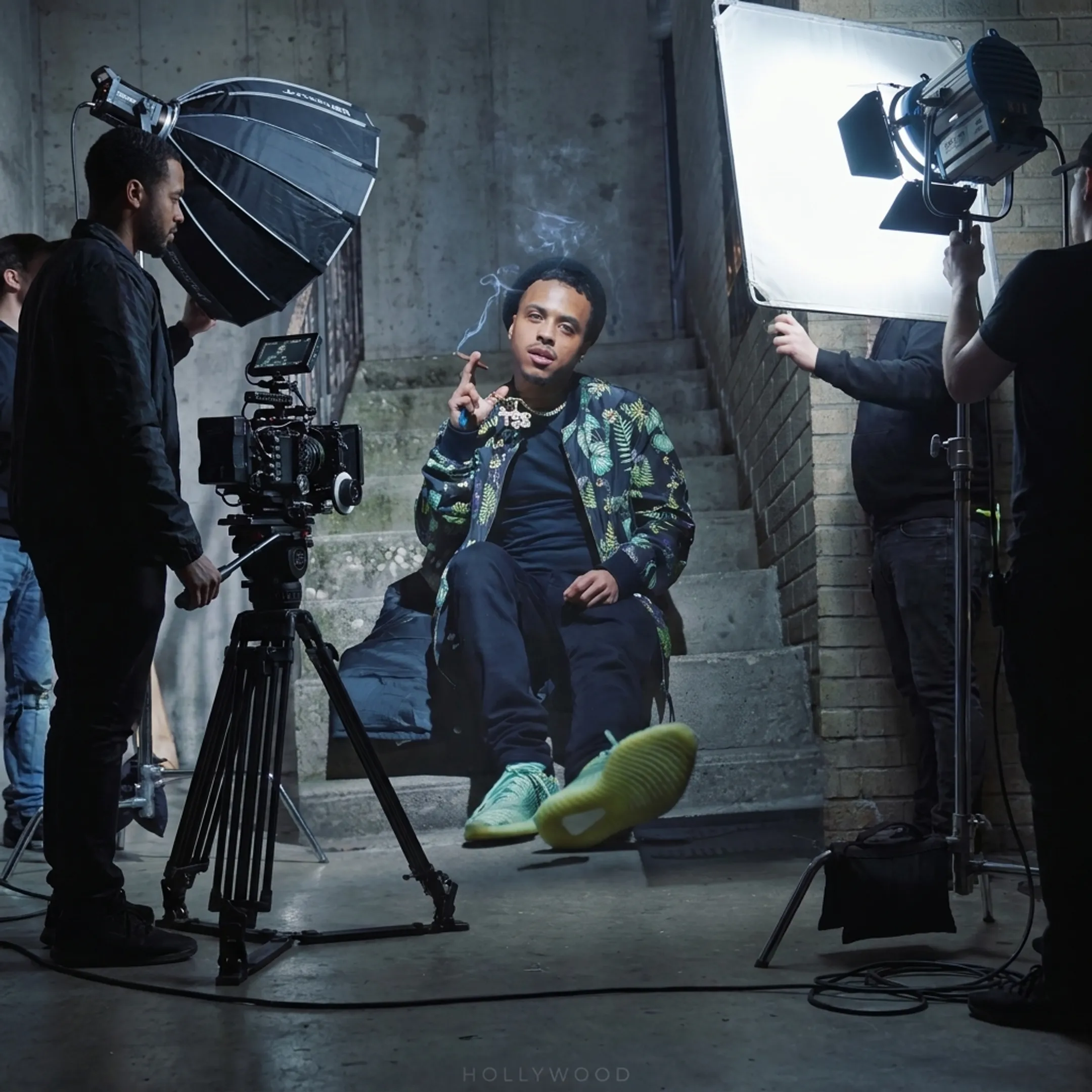 Music video production set with camera and promotional lighting