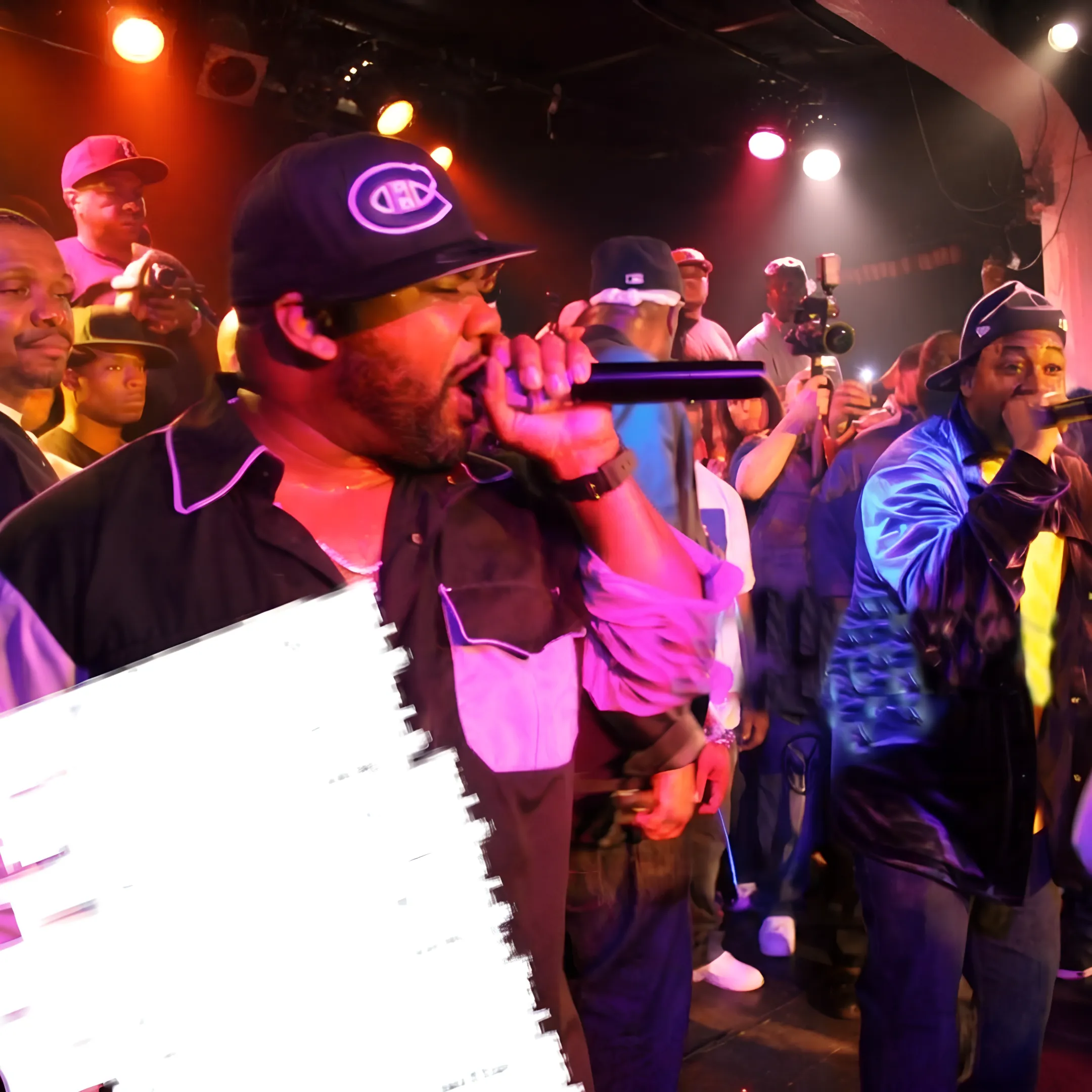 Music artists performing live on stage at a crowded concert event
