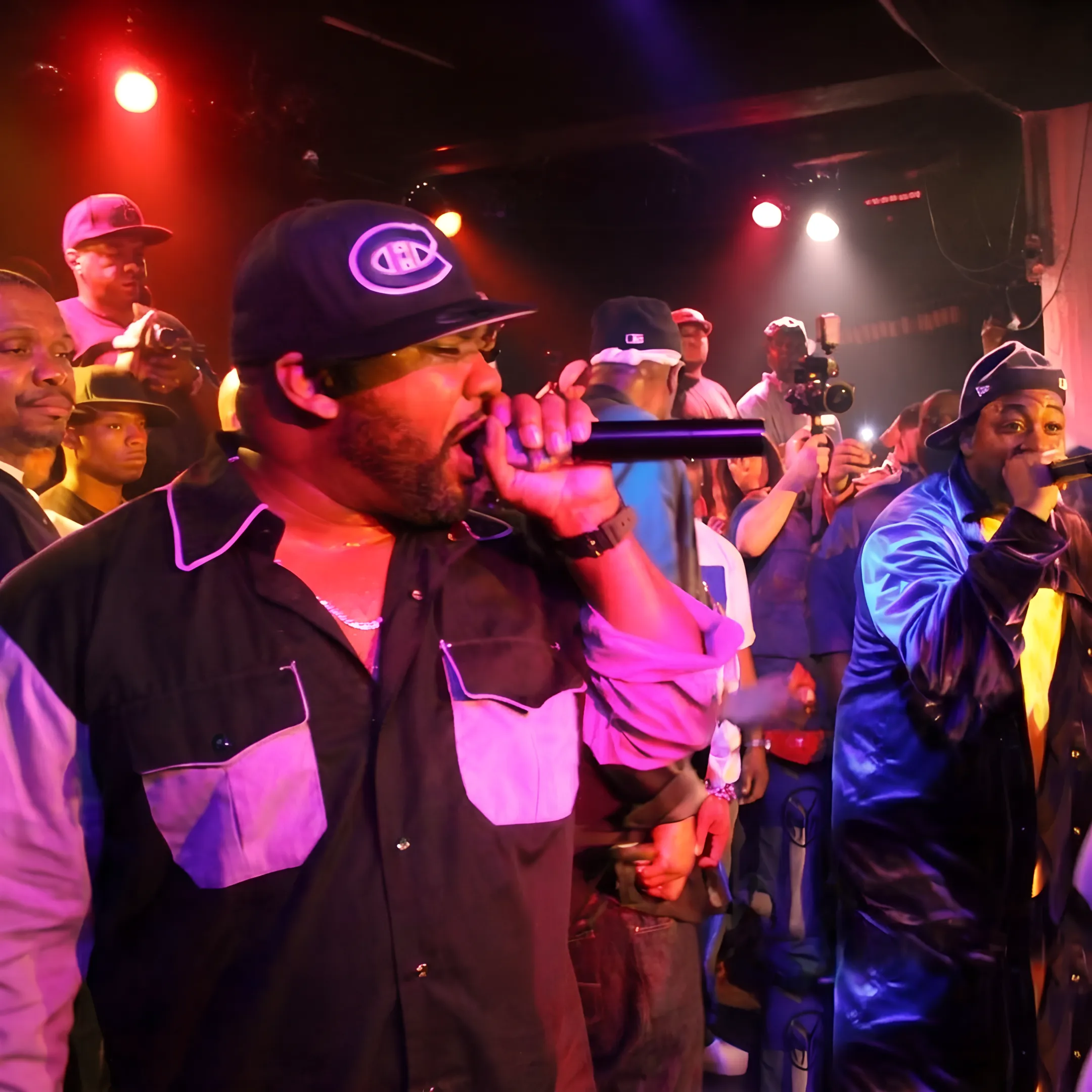 Rap artist performing with microphone at an upscale event