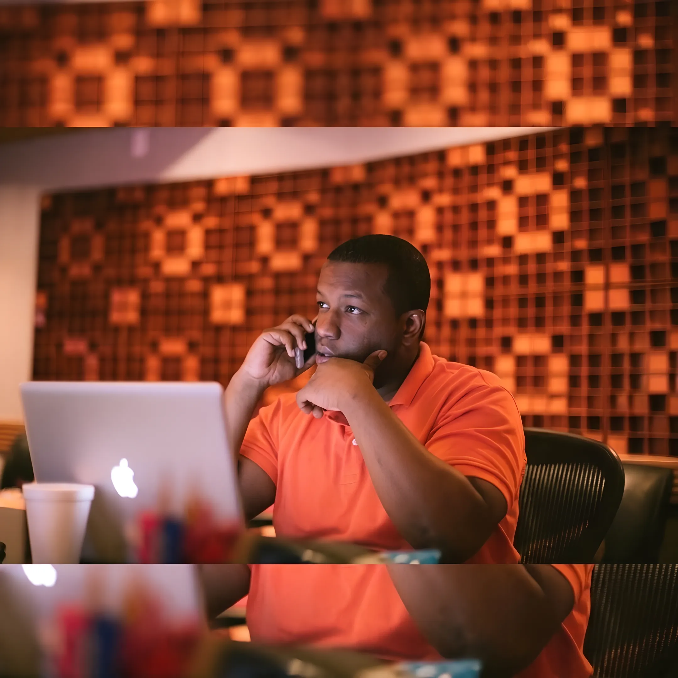 Music publicist preparing a press release campaign in a modern studio environment