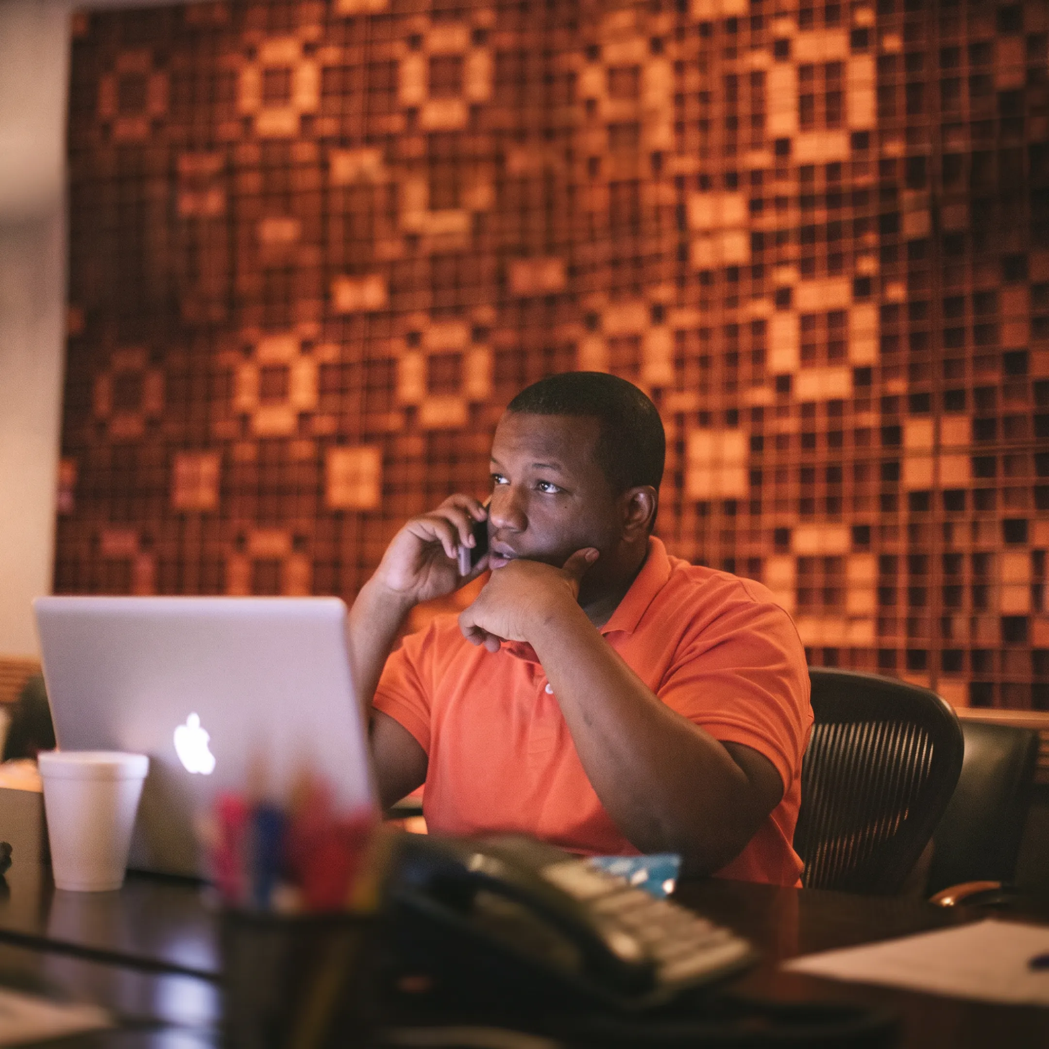 Music festival event consultant reviewing production schedule and stage blueprints