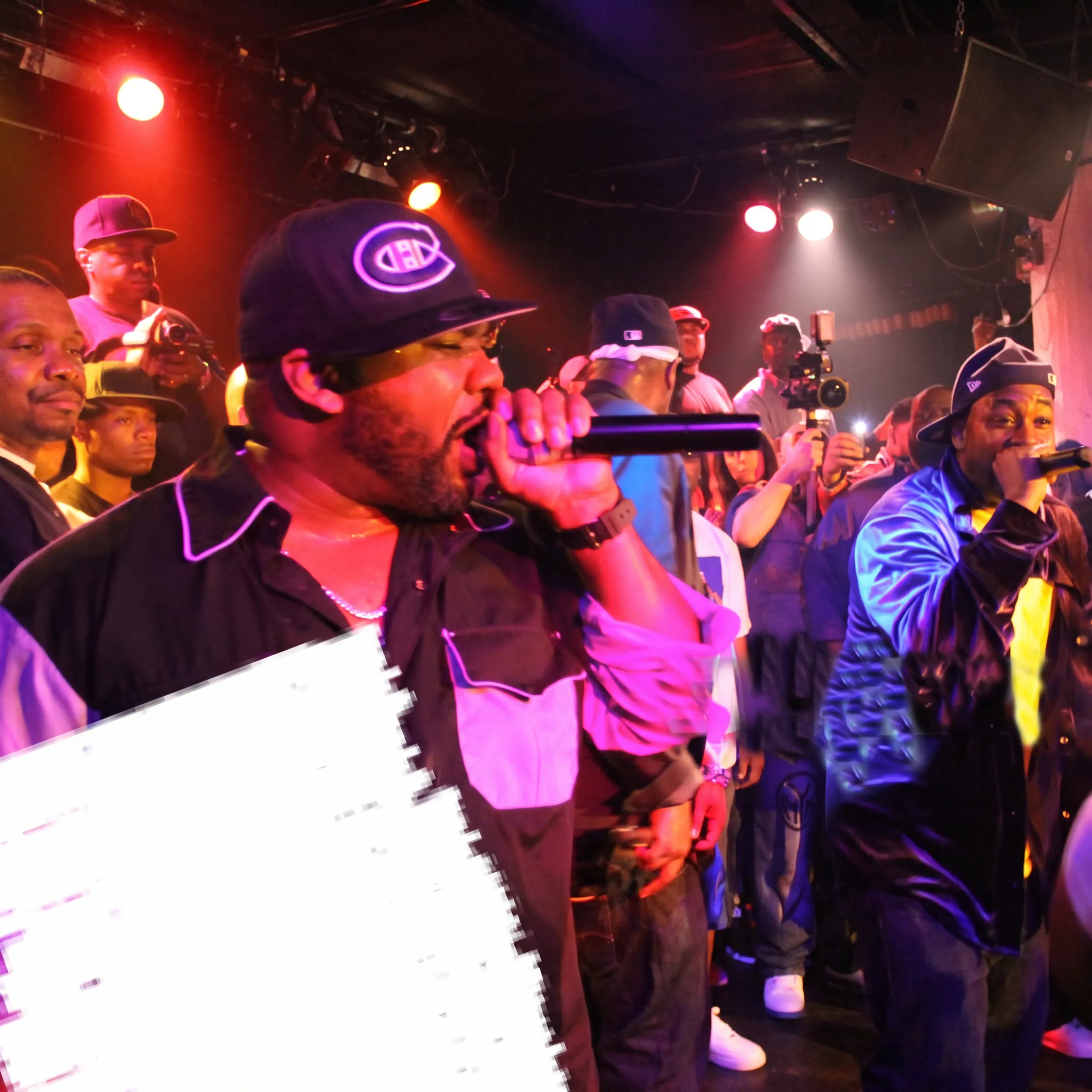 Live entertainment stage production with concert lighting and microphones