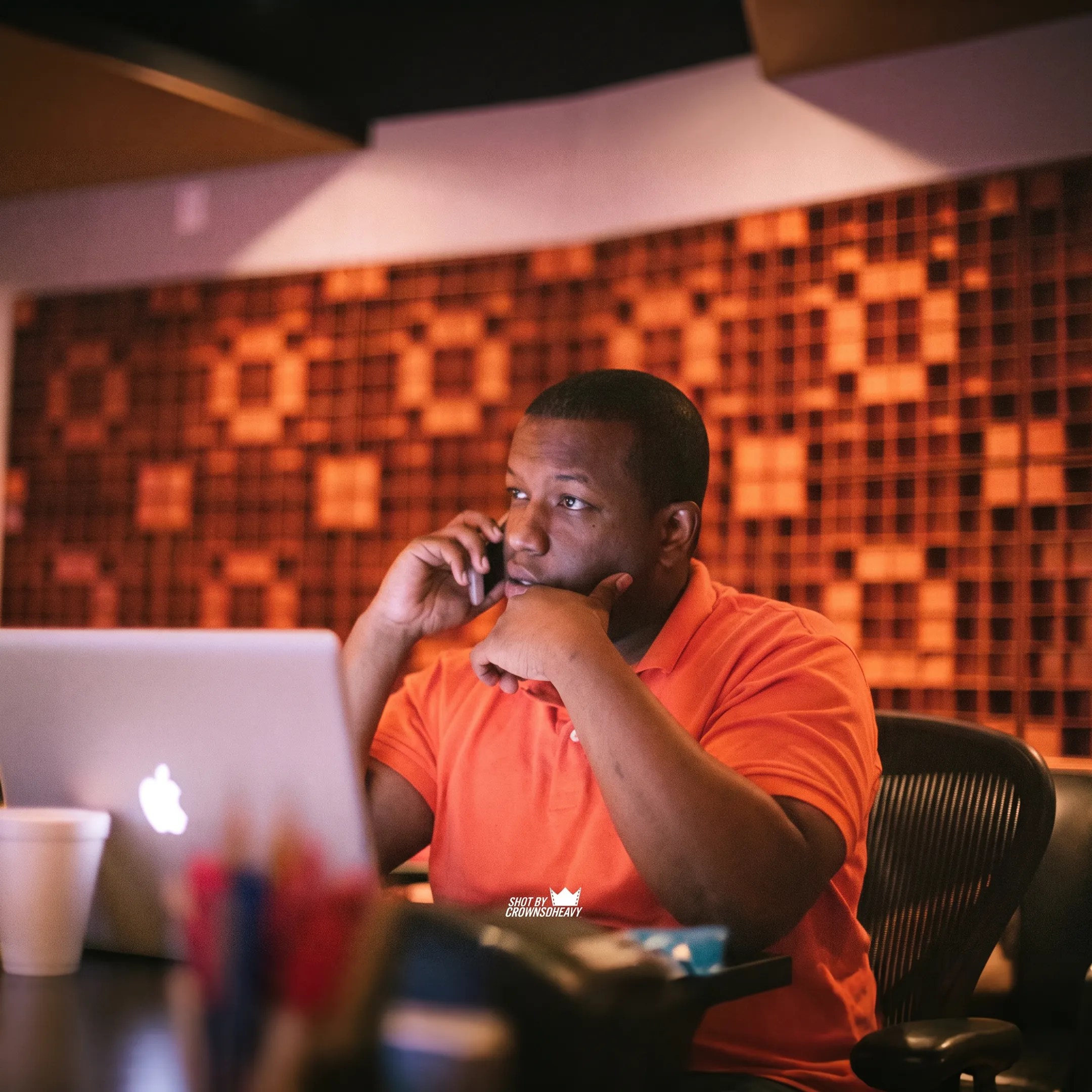 Music business coach reviewing marketing analytics and release plans on a laptop screen