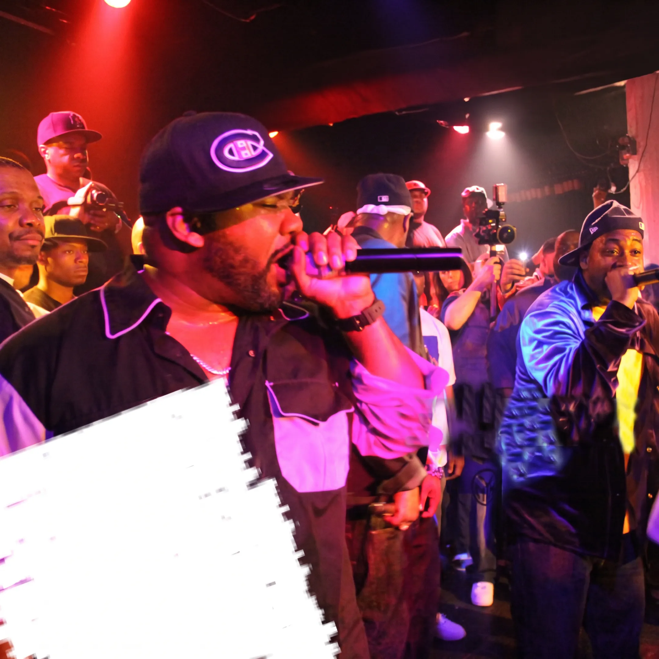 Independent musical artist performing live on stage under concert lights