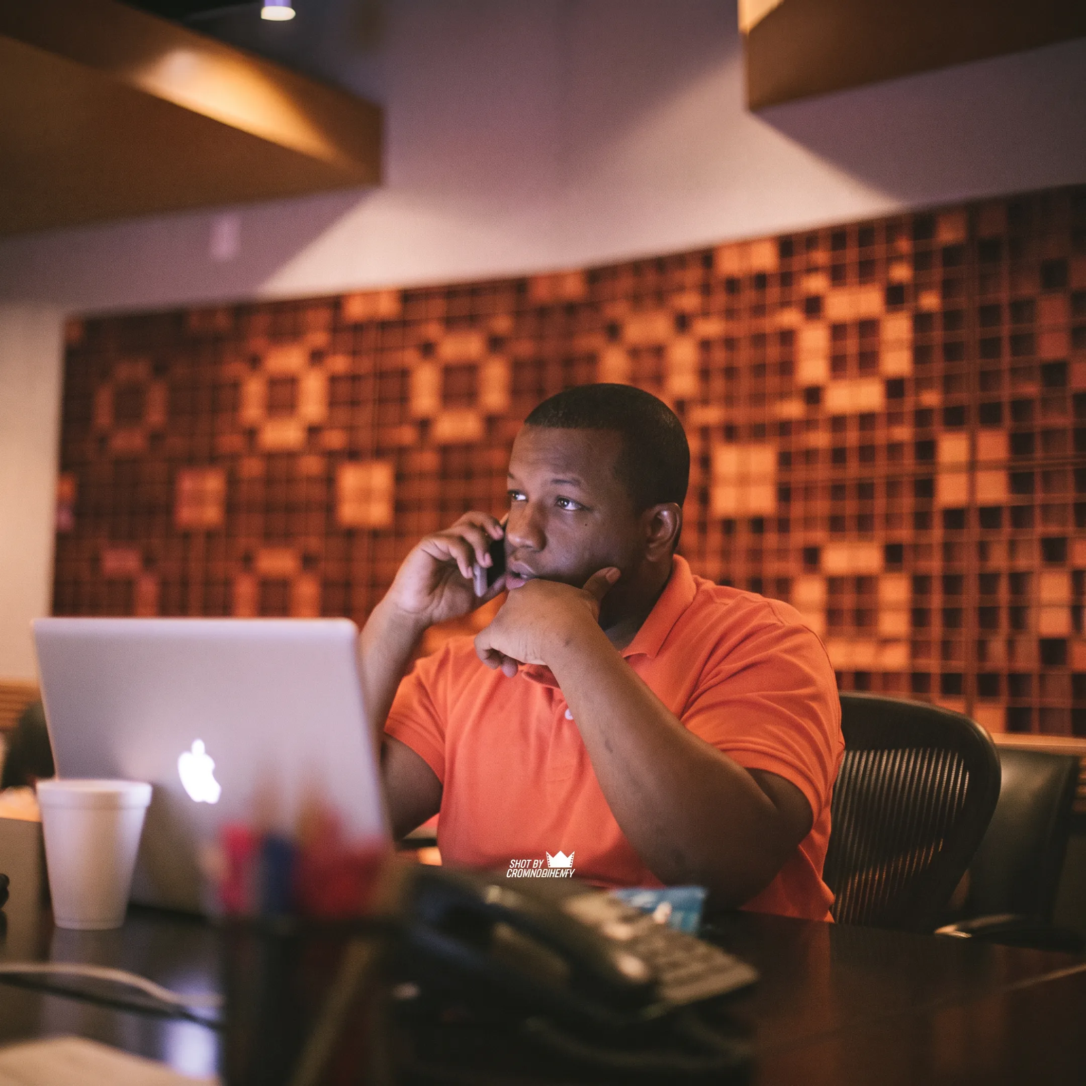 Music executive strategizing press releases and media campaigns with recording talent