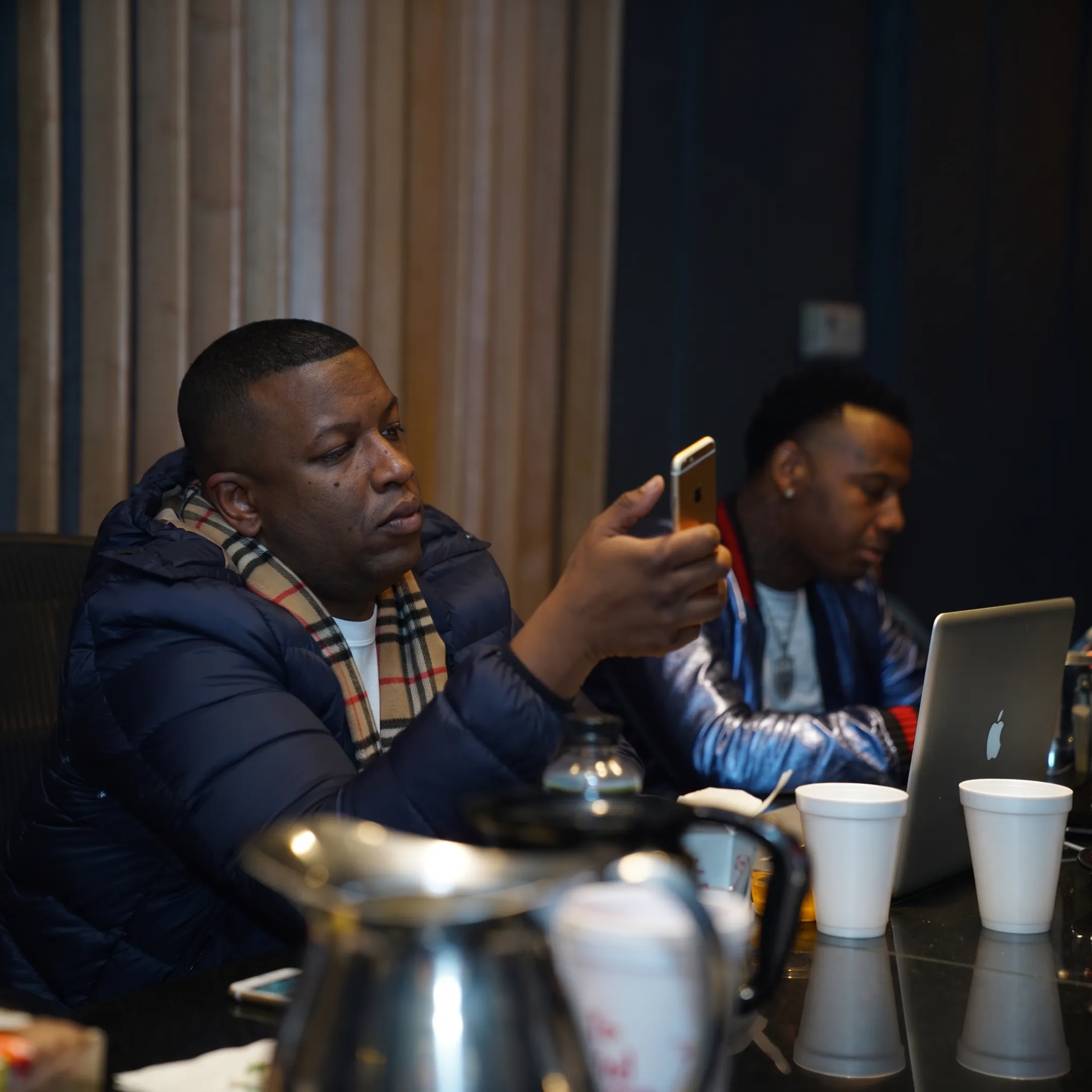 Entertainment public relations team planning a media campaign with artist promotional materials