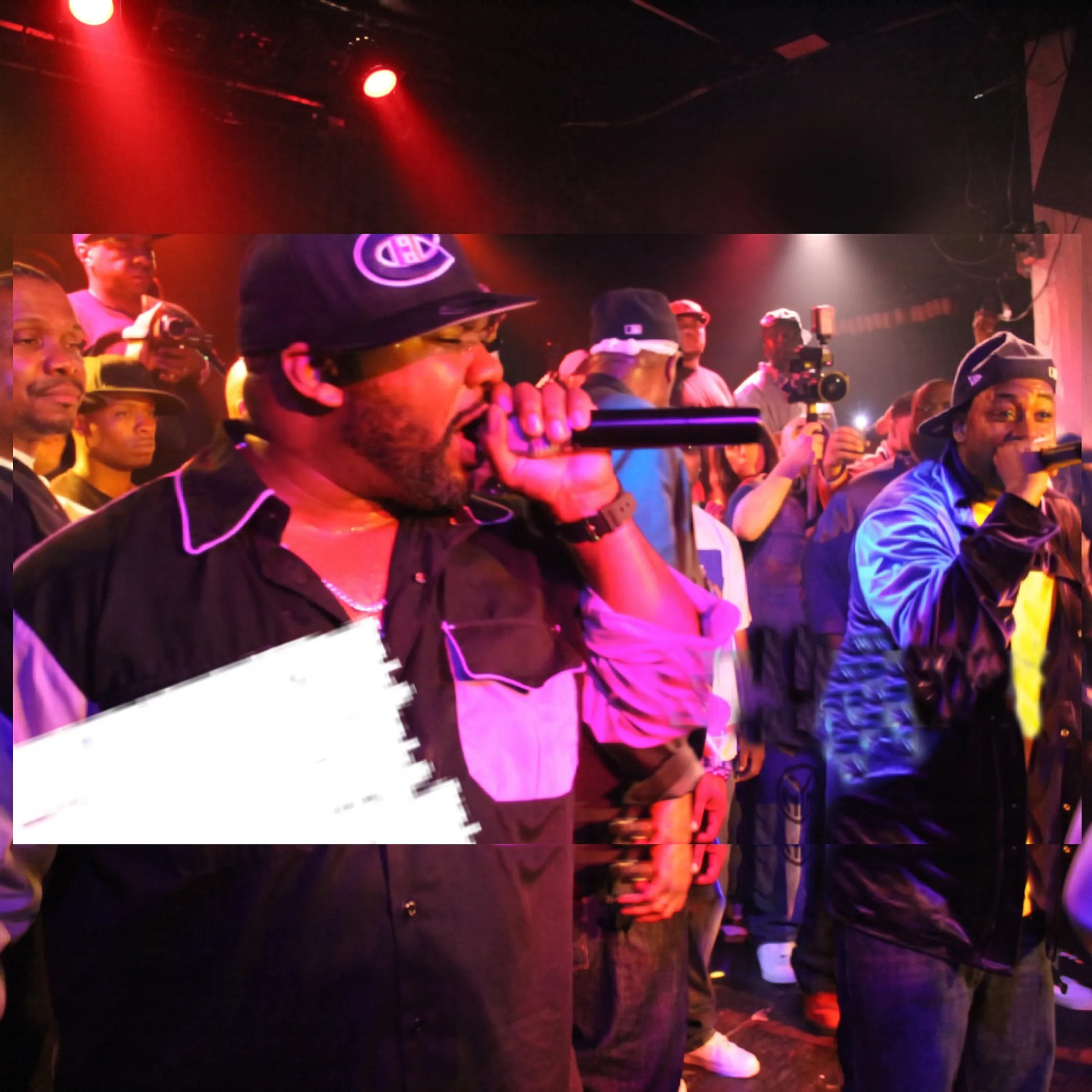 Music artist performing onstage before an engaged audience
