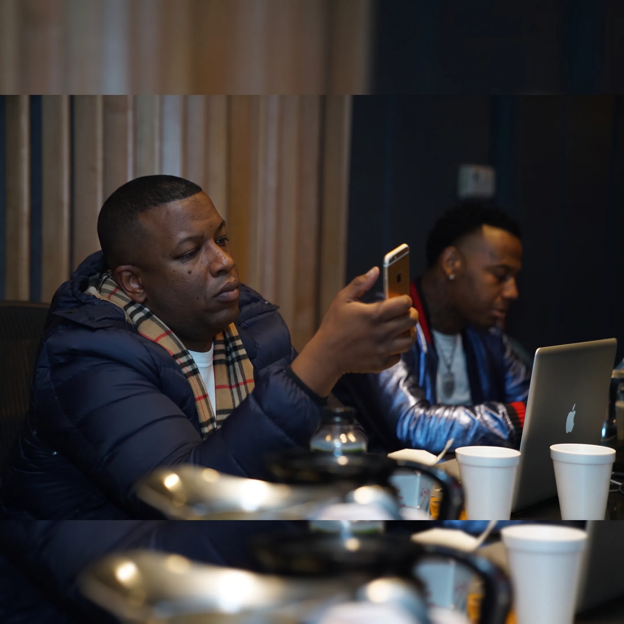 Music industry professional discussing an artist project in a studio