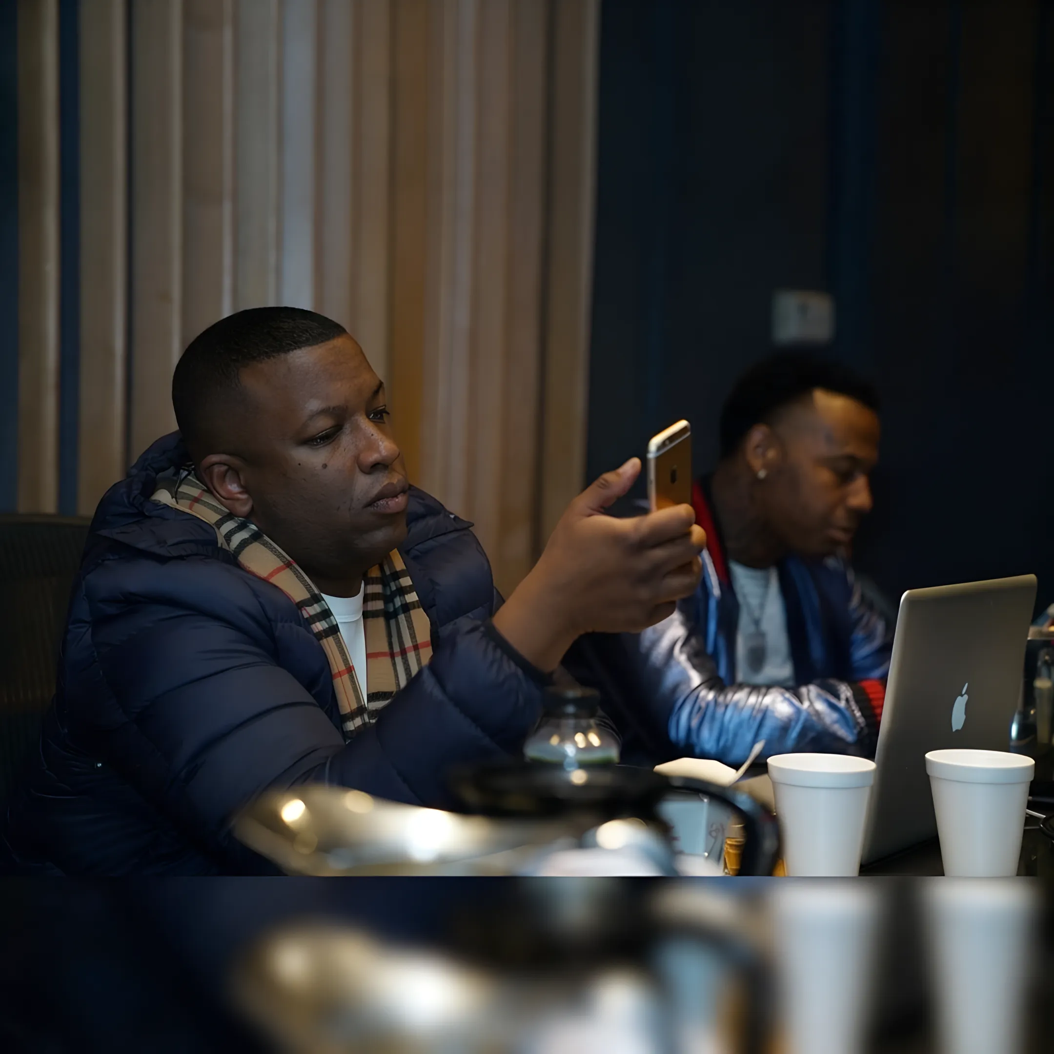 Entertainment executive advising a recording artist during a creative strategy meeting