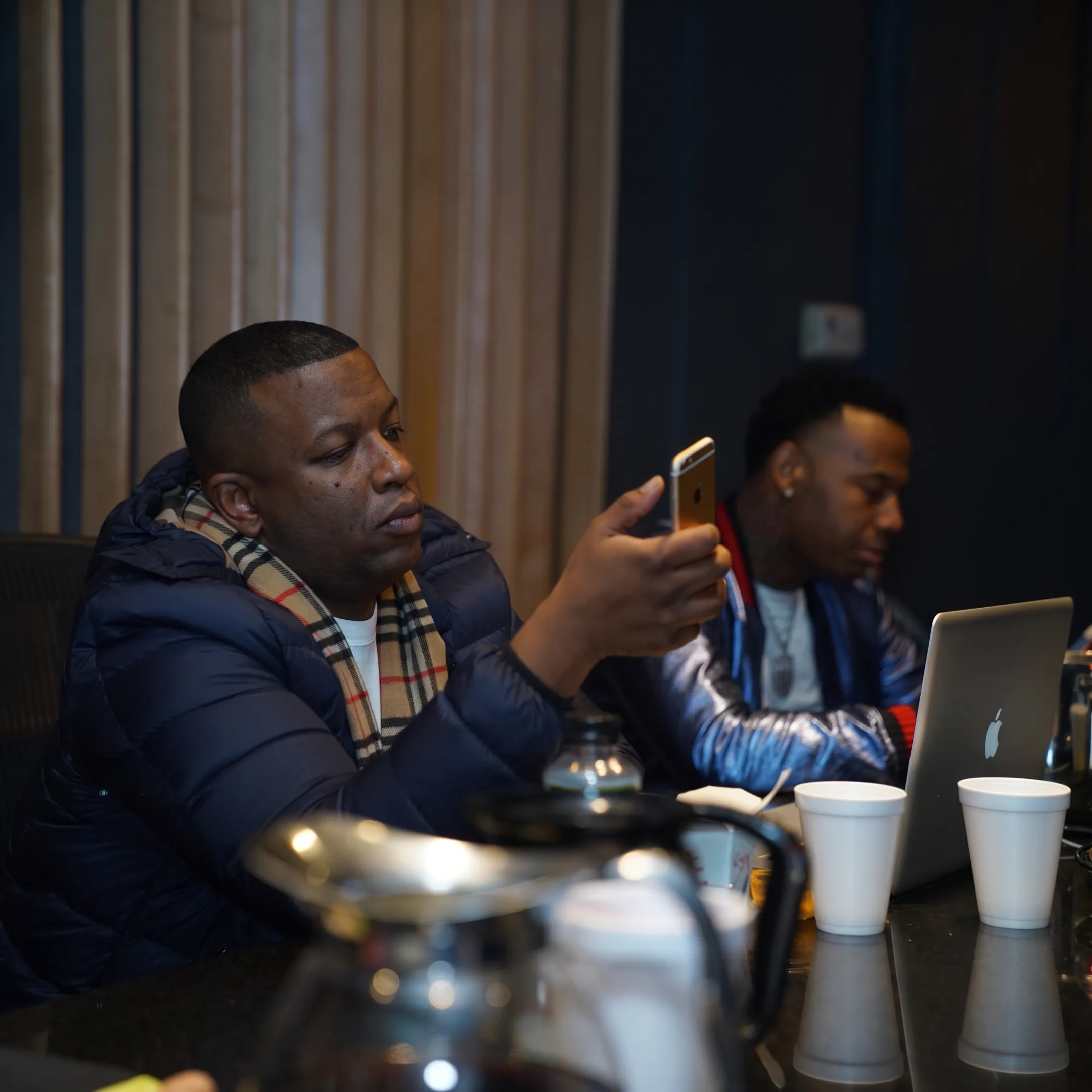 Artist manager meeting with a recording artist in a professional studio