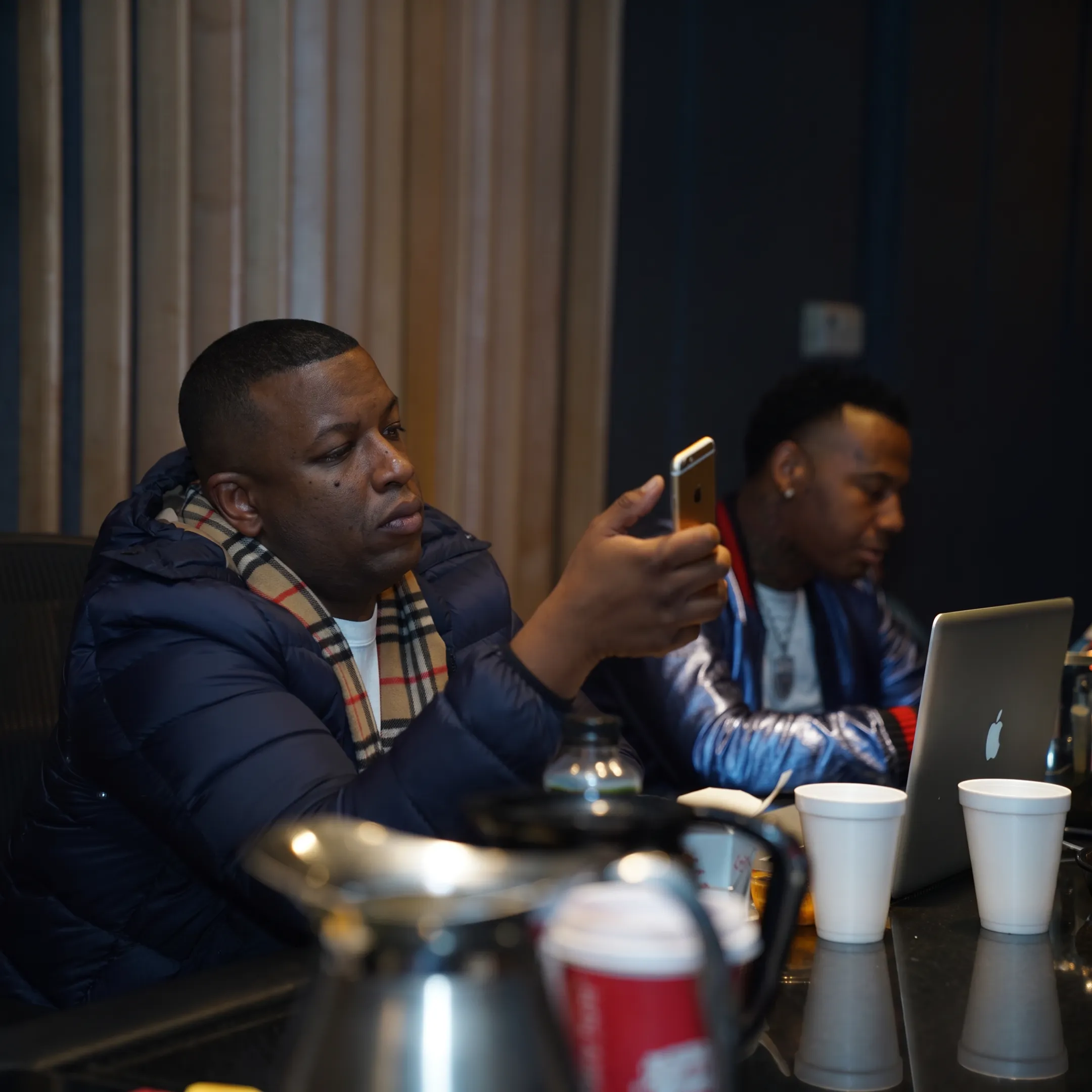 Music manager meeting with recording artist in Dallas studio