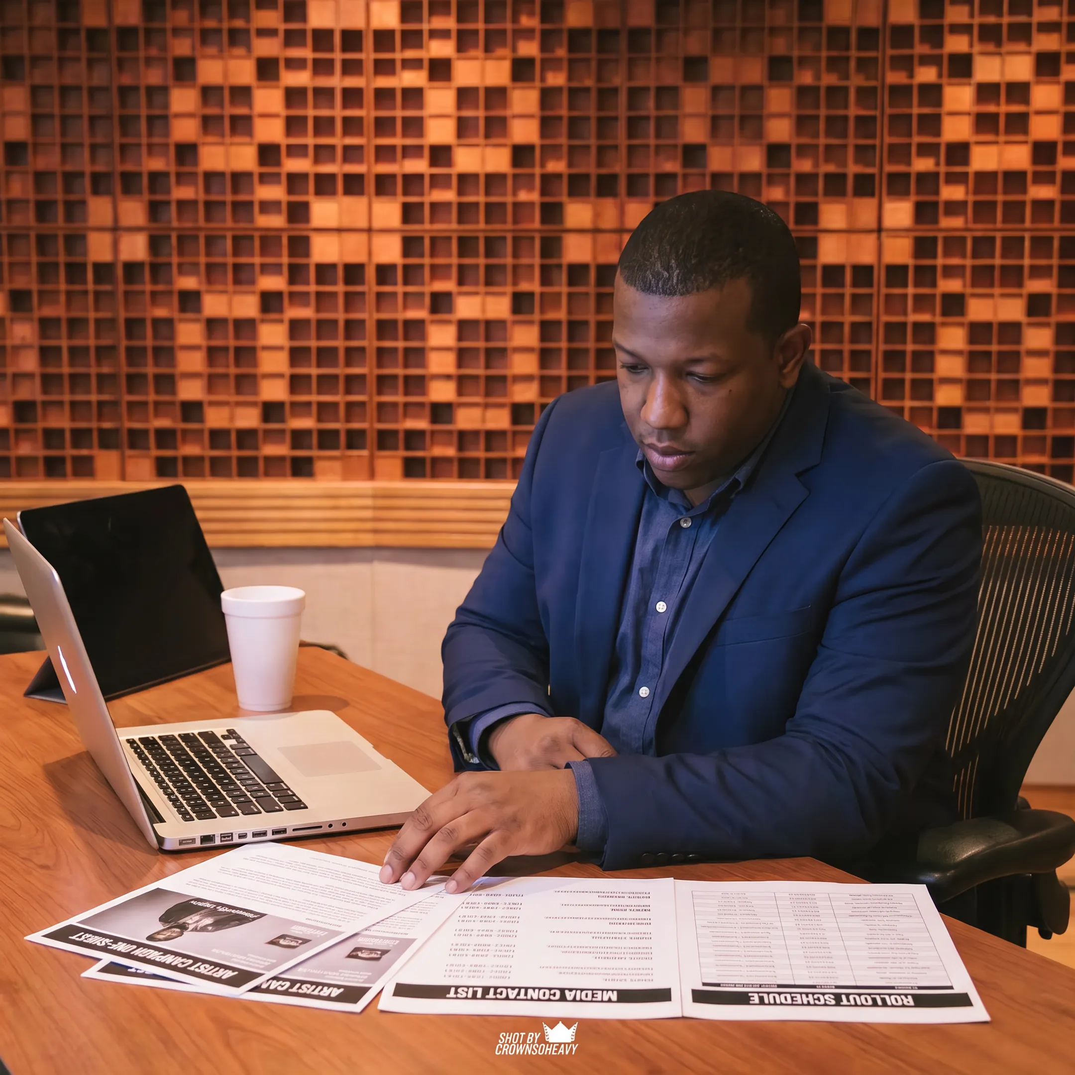 Entertainment publicist planning a media campaign for an artist in a New York City studio