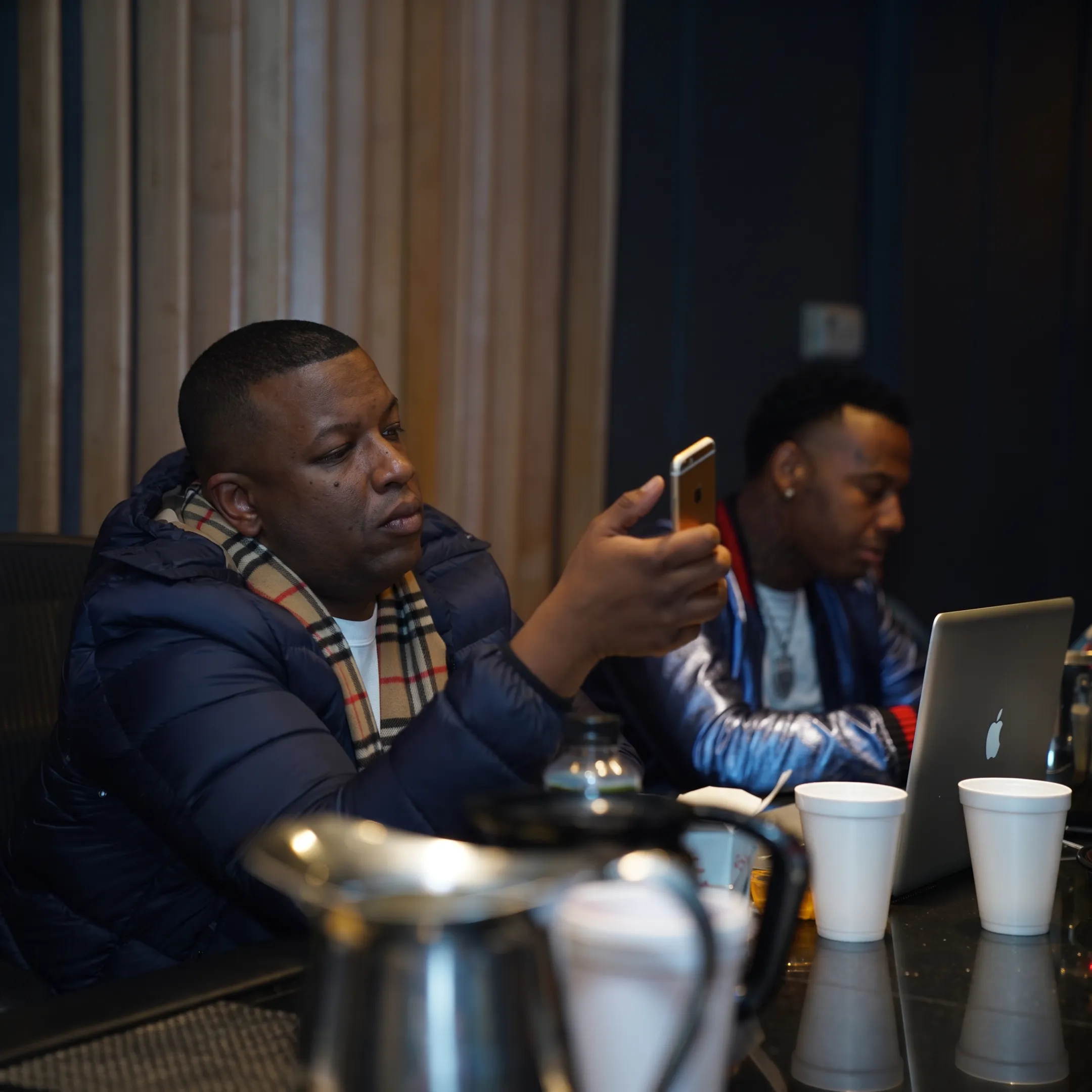 Entertainment publicist planning a music campaign with an artist in a London creative studio
